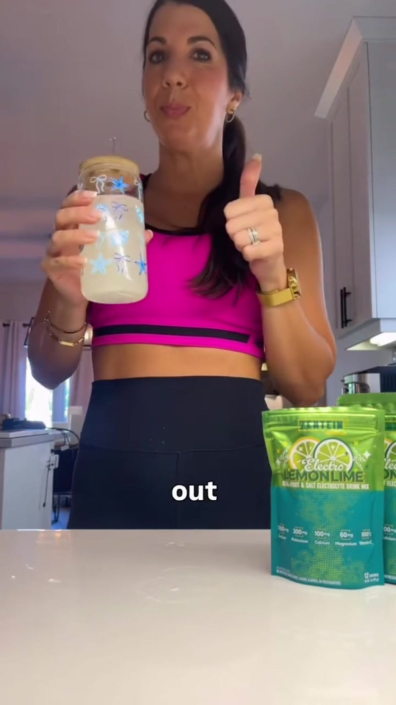 Patricia prepares and drinks Electro Lemon Lime at a kitchen counter after a workout.