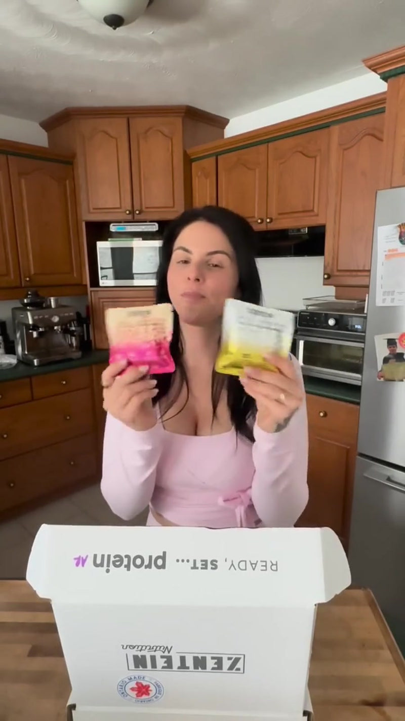 Sara tastes a Strawberry Blondie at her kitchen table with the package and Zentein box in view.