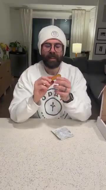 Luca holds a Honey Peanut Crispy Elite Square during his tasting.
