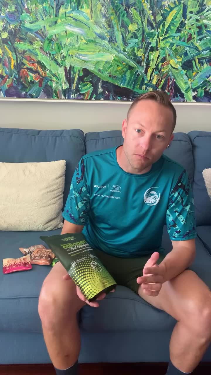 Taylor Reid holding Superfood Collagen, with Elite Squares and Strawberry Blondie beside him.